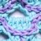 A close up of a scale on the light blue scarf option.
